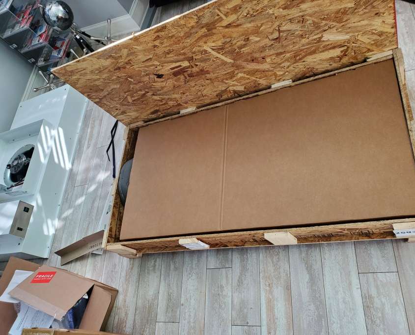 Clean room flow hood and blower motor unpacked from the shipping crate during the 2020 laboratory build