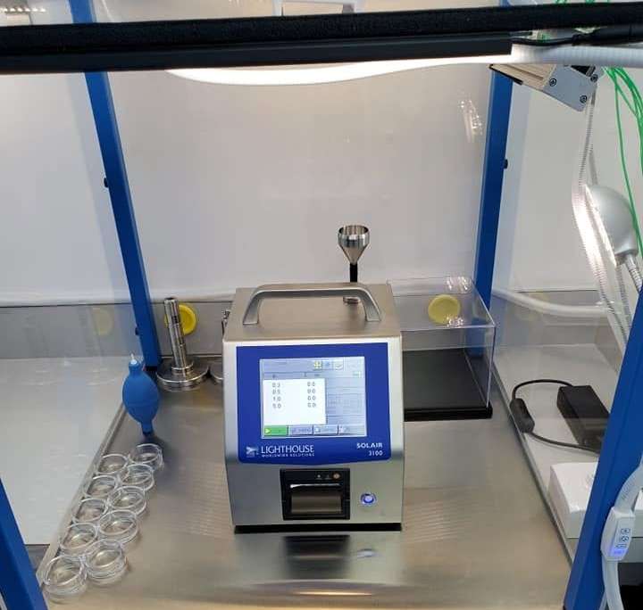 Lighthouse SOLAIR 3100 particle counter inside Tri-State Data Recovery's second ISO Class 4 certified flow hood, showing zero counts at 0.3, 0.5, 1.0 and 5.0 microns