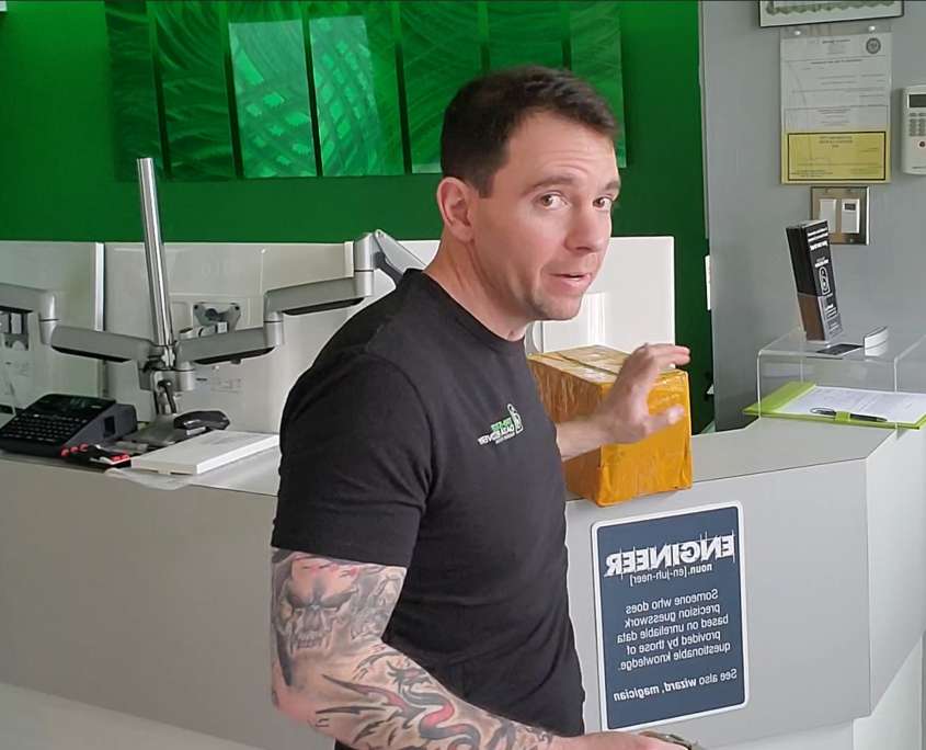 Don Anderson of Tri-State Data Recovery holding a shipped package at the King of Prussia office, explaining how to pack a hard drive for data recovery